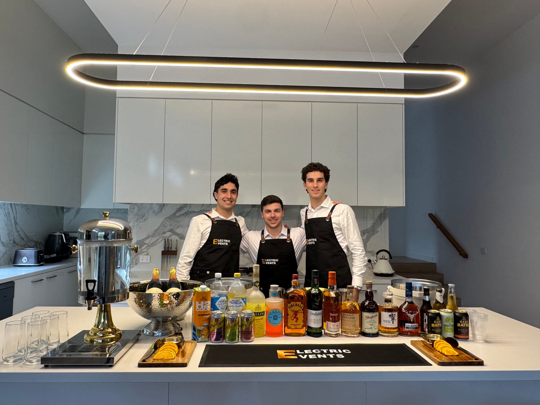 The Electric Events crew behind a fully set up bar at a Melbourne private event